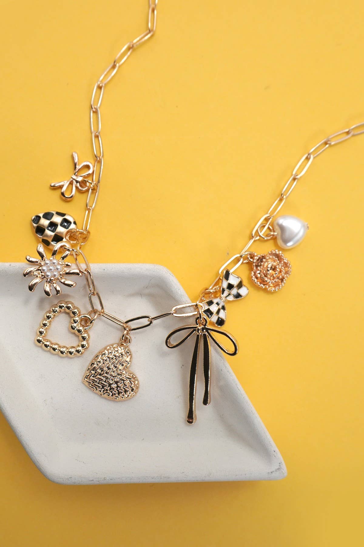 BOW CHECKER HEART FLORAL CHARM NECKLACE
